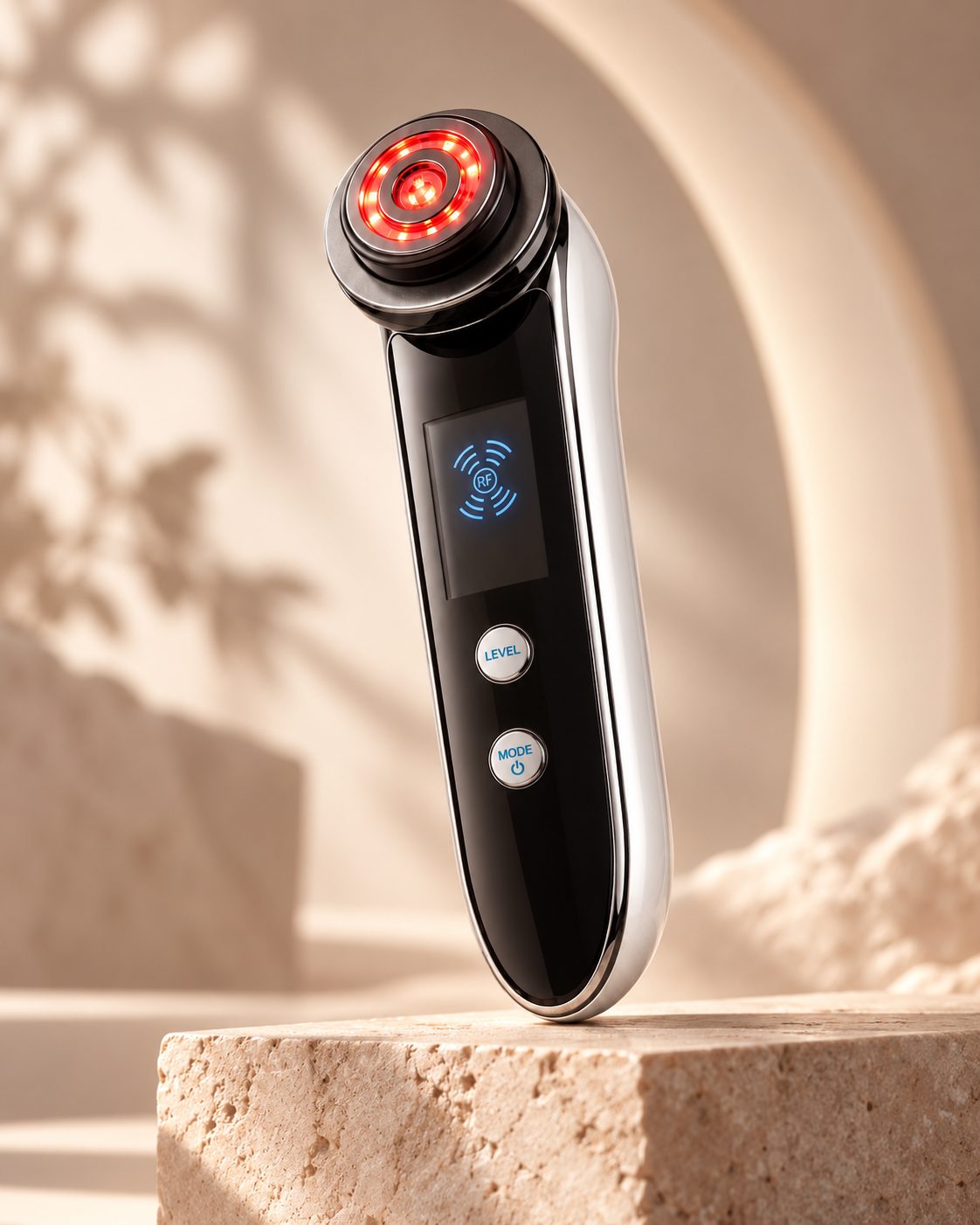 Noma Lift Skin Glow facial device on a travertine pedestal
